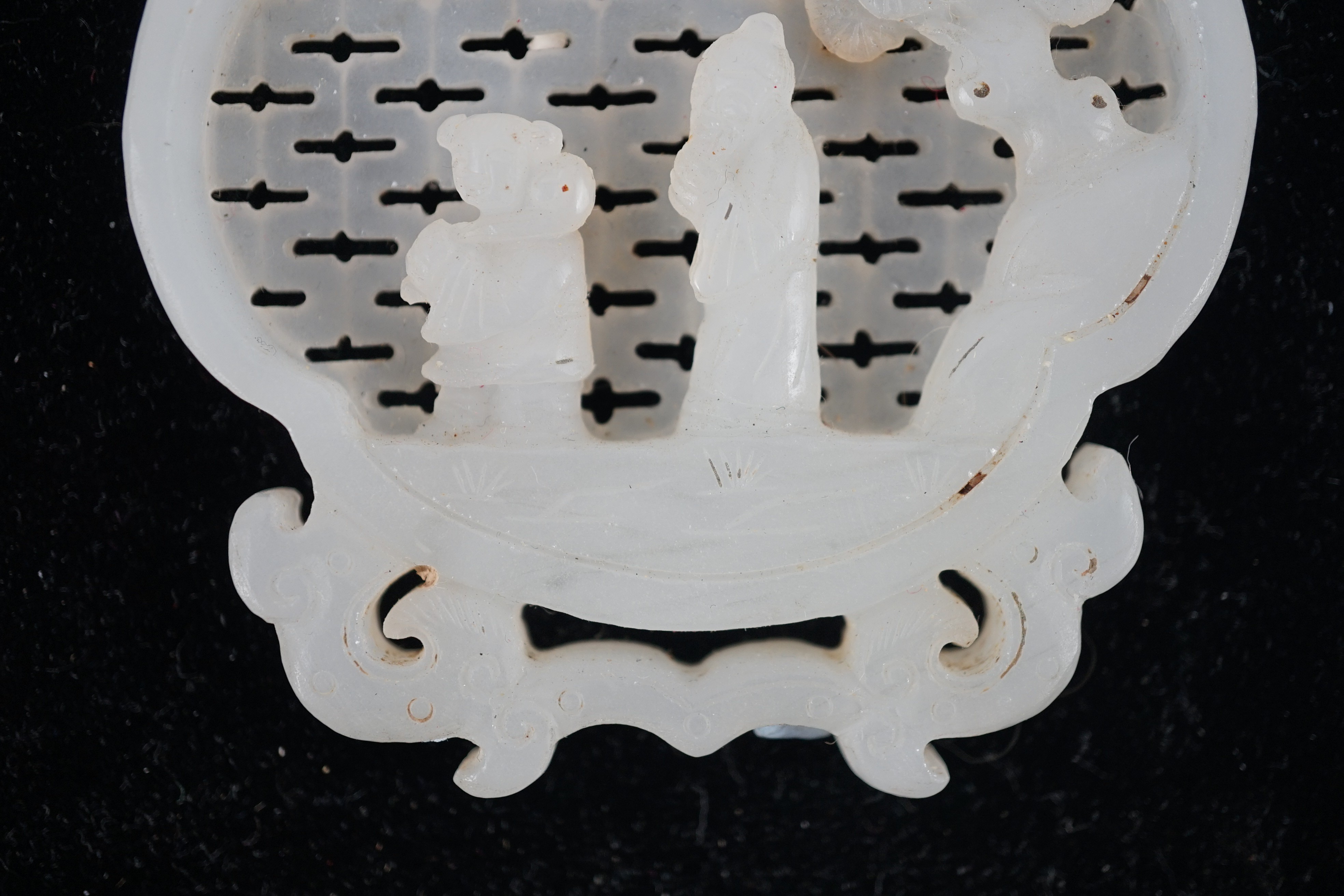 A Chinese white jade reticulated plaque, 19th century, 10.2cm high